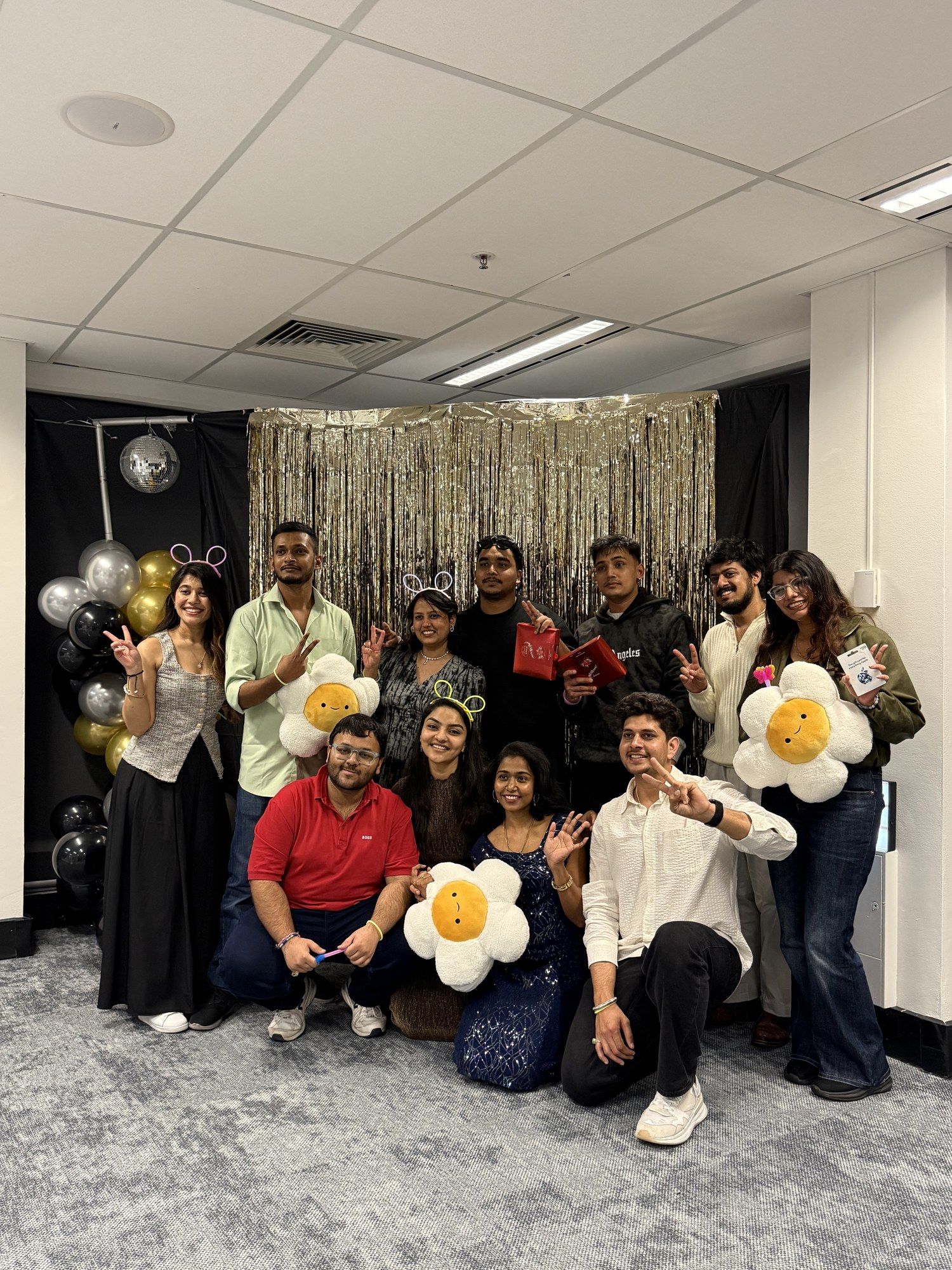 The SISA committee with flower balloons at the End of Semester Party.